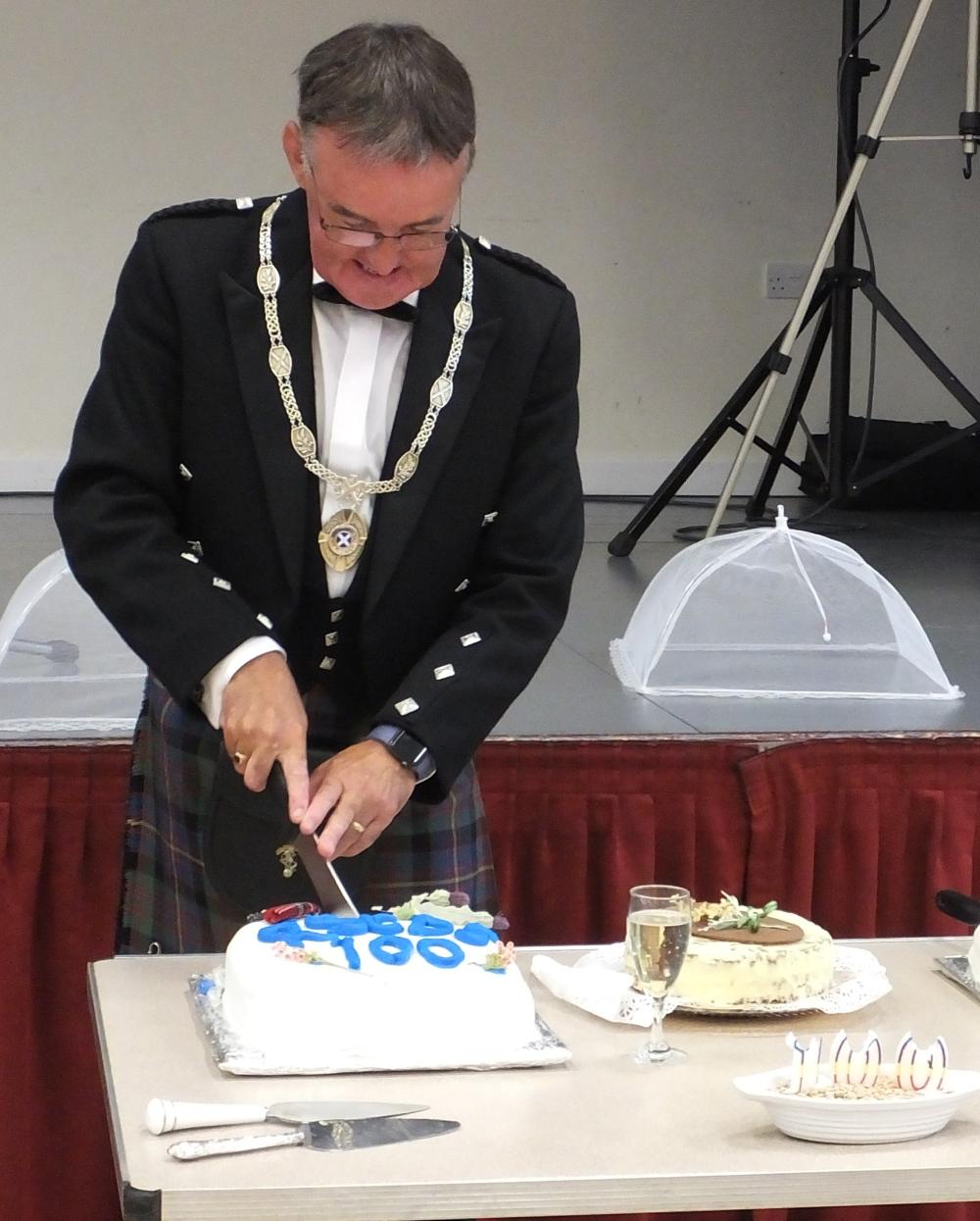 EACB photo - William Williamson cutting the cake